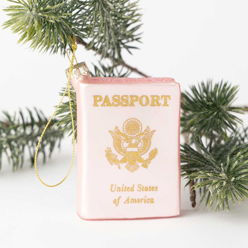 Passport glass ornament pine needle background