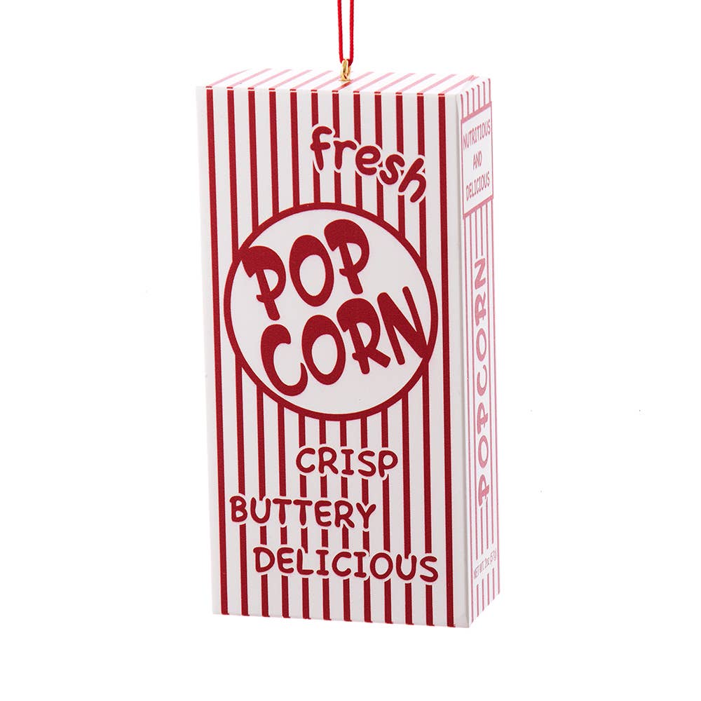Decorative popcorn box ornament with red and white striped design on a white background