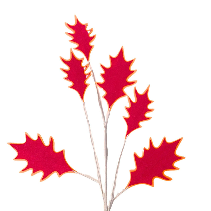 Red artificial leaves on a white background