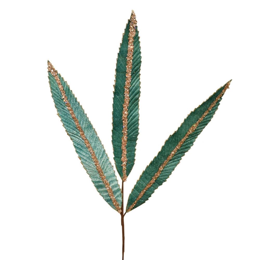 Artificial green leaf with gold edges on a white background