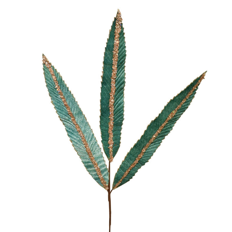 Artificial green leaf with gold edges on a white background