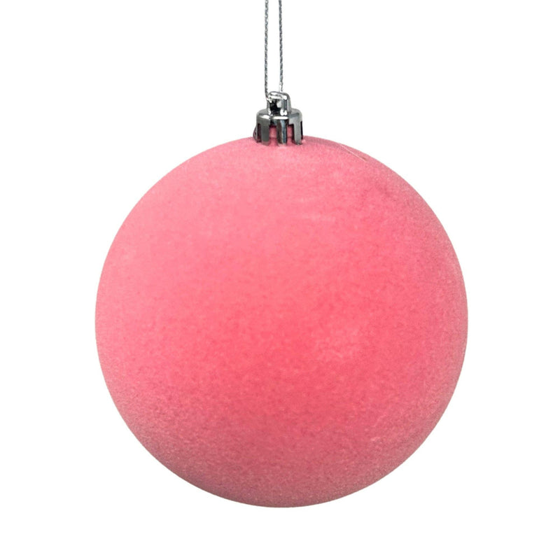 Pink Christmas ornament on a white background