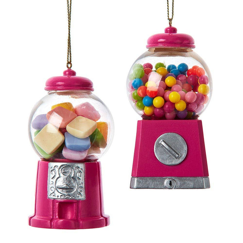Two pink gumball machines filled with colorful candies on a white background