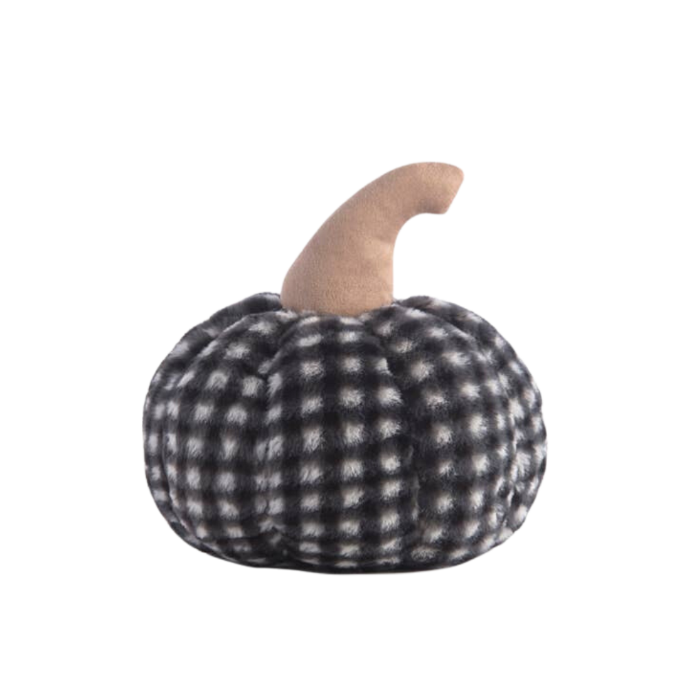 A medium-sized faux fur pumpkin-shaped pillow with a black and white checkered pattern.