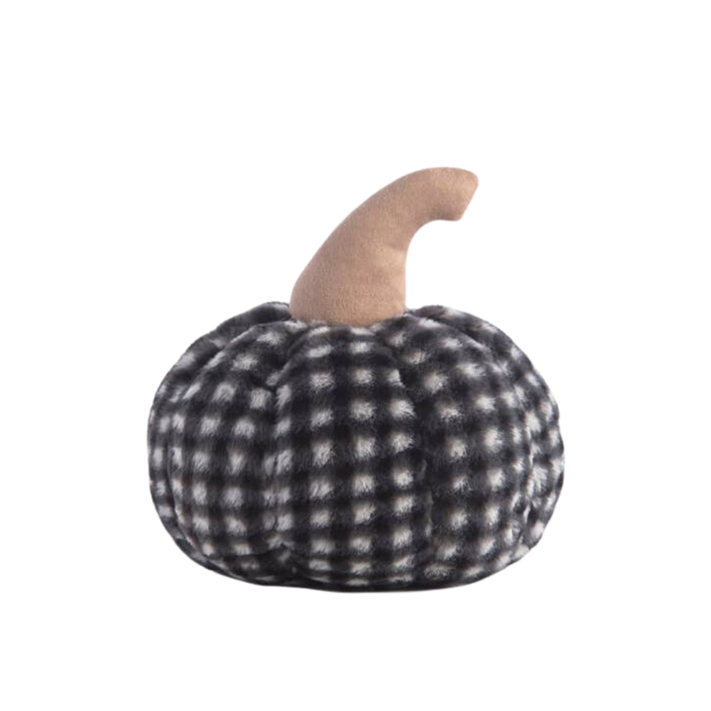A medium-sized faux fur pumpkin-shaped pillow with a black and white checkered pattern.