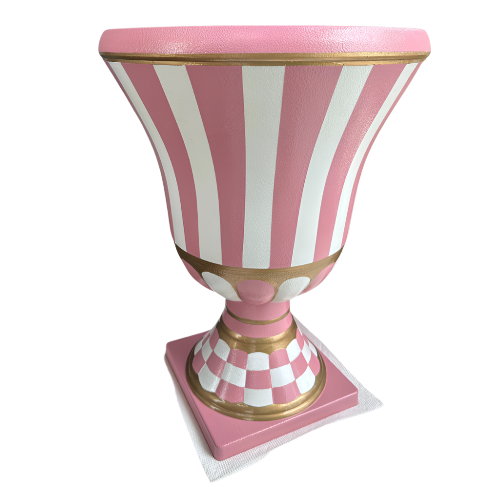 Decorative urn with pink and white striped design on a white background