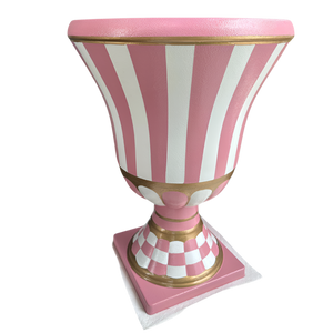 Decorative urn with pink and white striped design on a white background