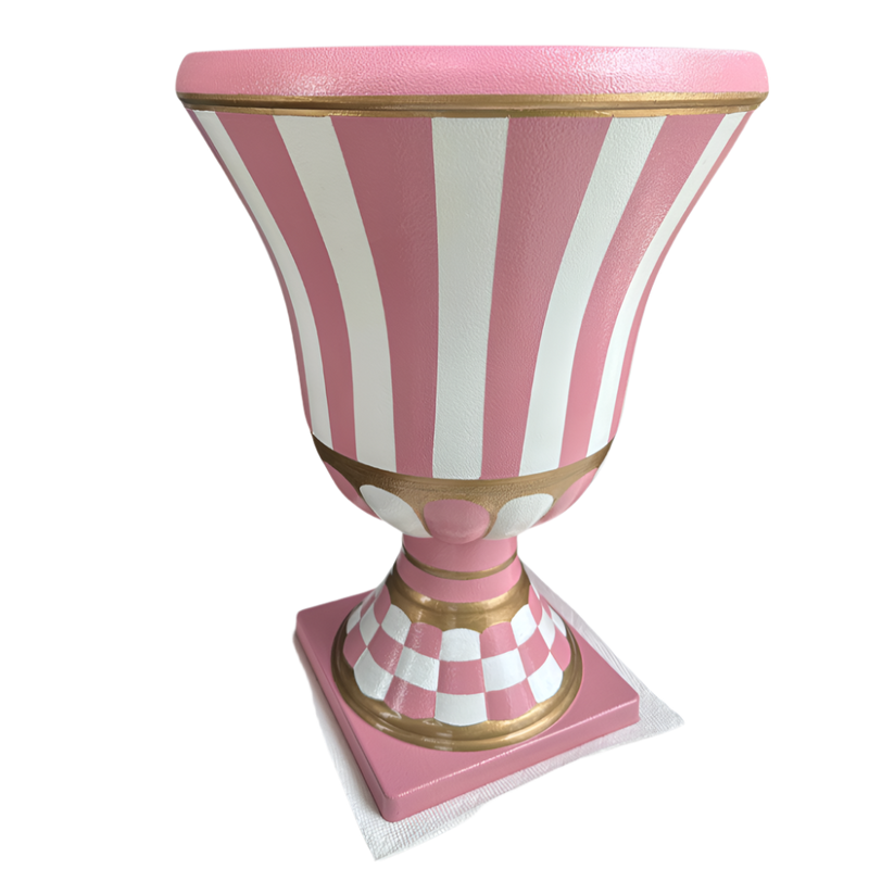 Decorative urn with pink and white striped design on a white background