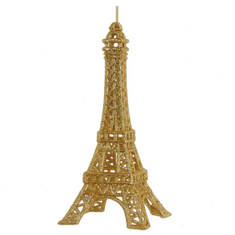 Gold Eiffel Tower ornament on a white background