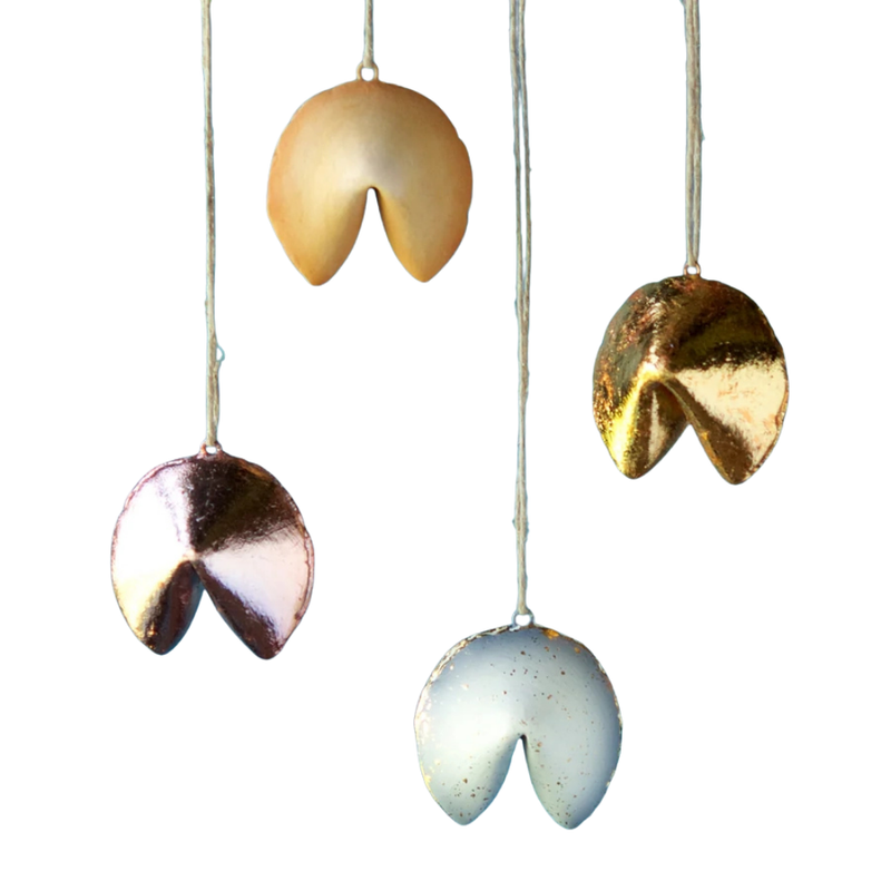 Set of four ceramic fortune cookie-shaped ornaments in various colors on a white background