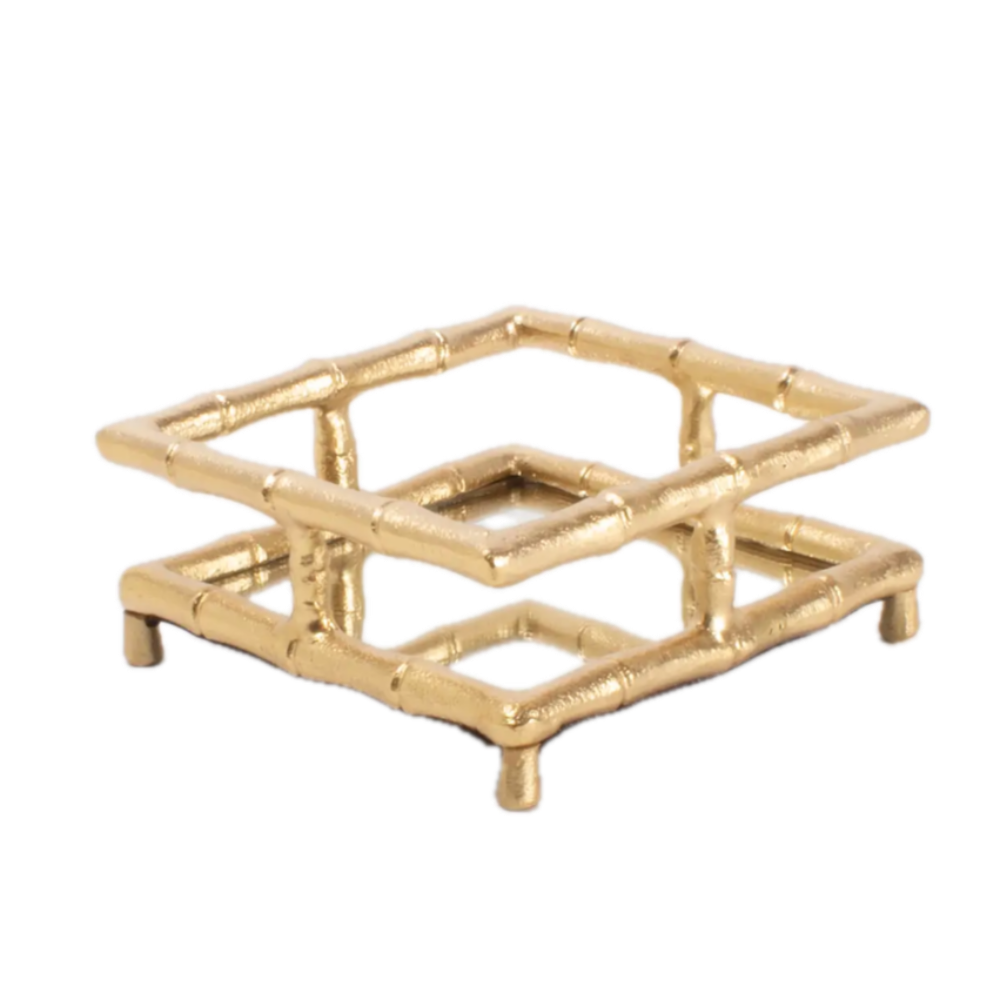 Gold decorative tray with a geometric design on a white background