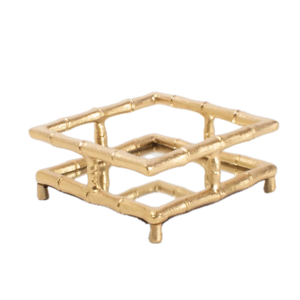 Gold decorative tray with a geometric design on a white background