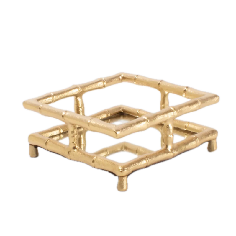 Gold decorative tray with a geometric design on a white background