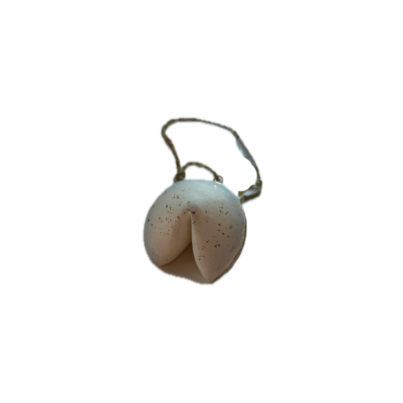 White shell with a small bell on a white background