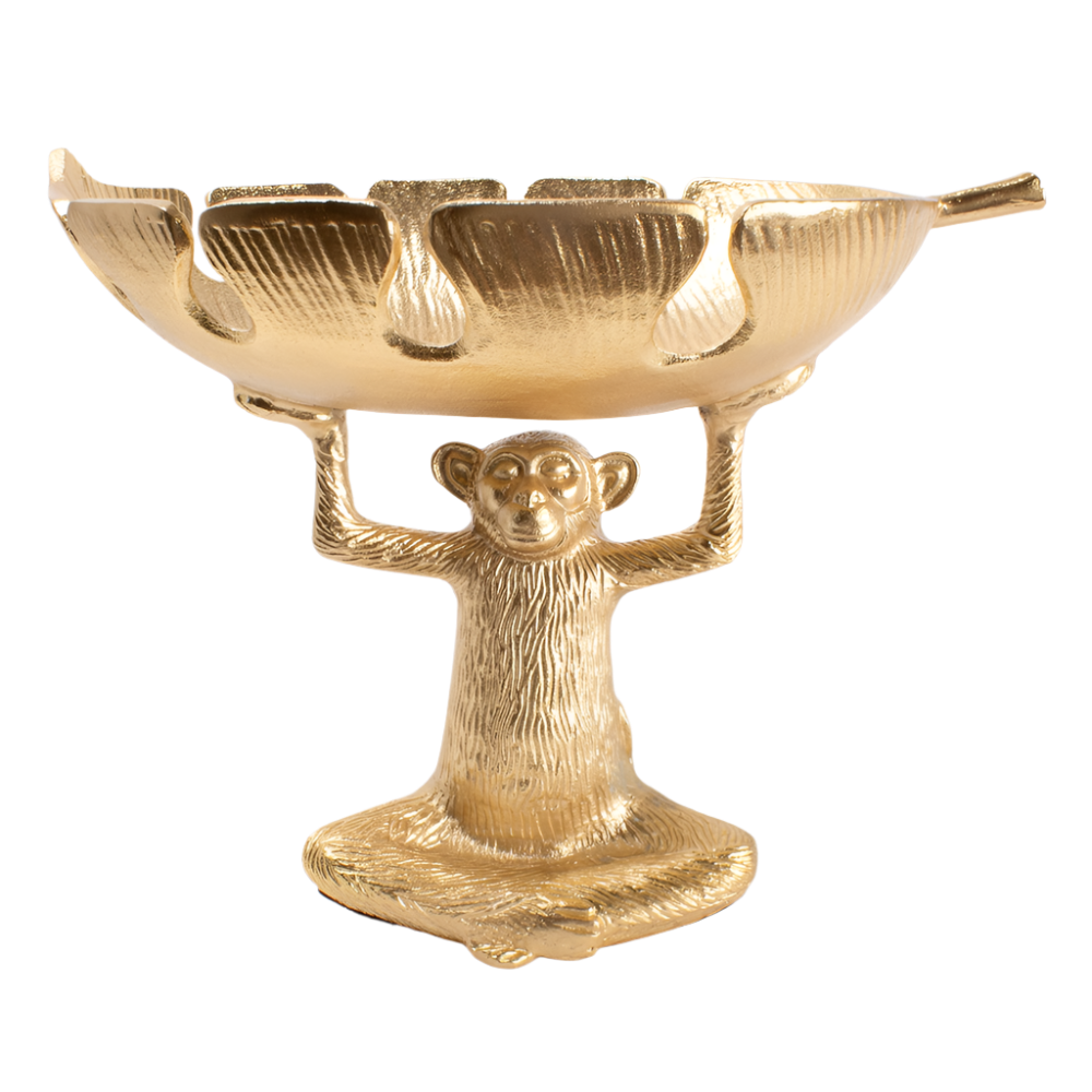 A gold-colored decorative bowl featuring a monkey figure.