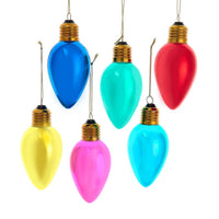 Colorful Christmas light bulb ornaments on a white background
