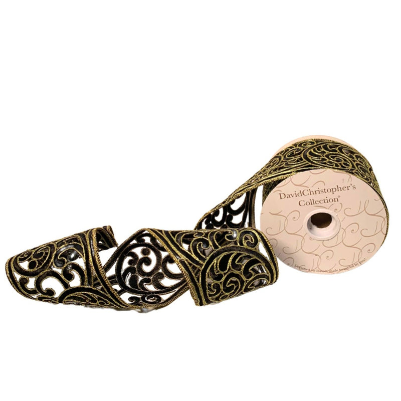 Decorative ribbon spool with intricate design on a white background