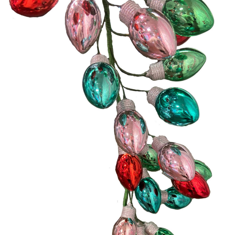 String of multicolored Christmas lights on a white background