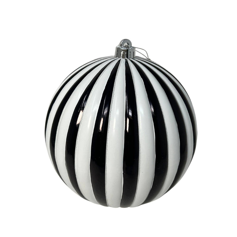 Black and white striped Christmas ornament on a white background